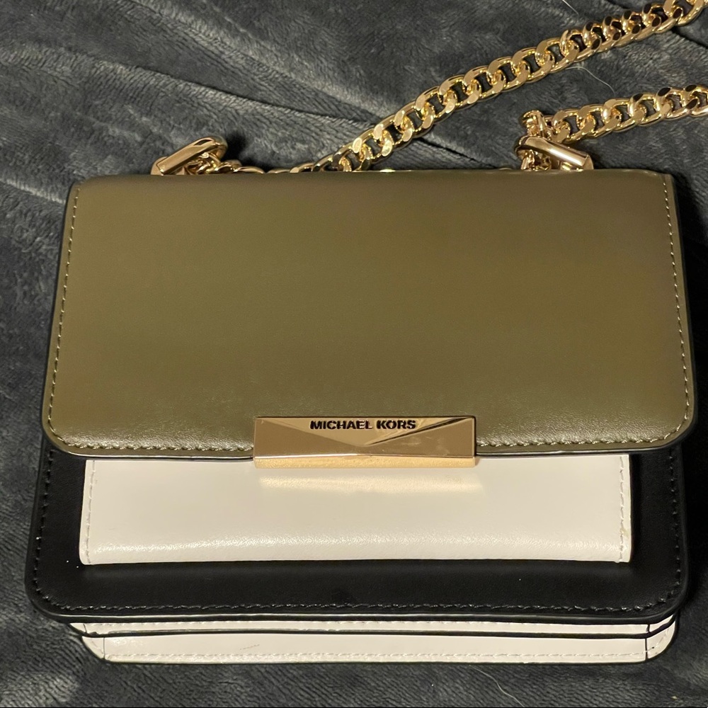 Black Green and White Michael Kors mini with adjustable gold chain. Like new